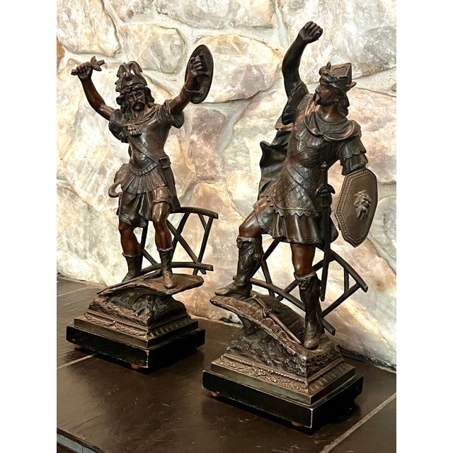 Pair of Bronzed Finish Spelter Figures of Gallic Warriors in the Style ofTheodore Doriot Two standing figures perched upon...