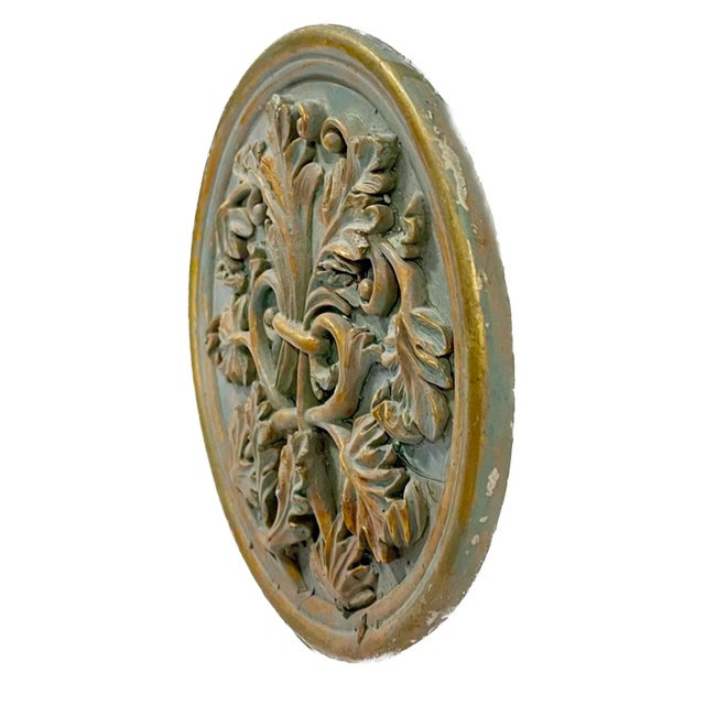 Vintage gilt plaster acanthus leaf medallion wall plaque. Gilt on plaster depicting bundled acanthus leave design with...