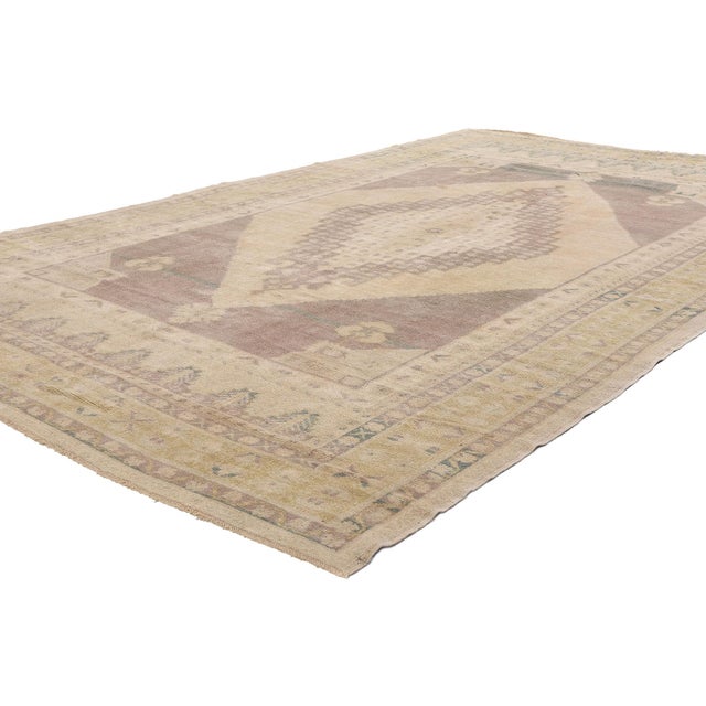 53683 Vintage Turkish Oushak Rug, 06'04 x 10'06. This hand-knotted wool vintage Turkish Oushak rug presents a serene...