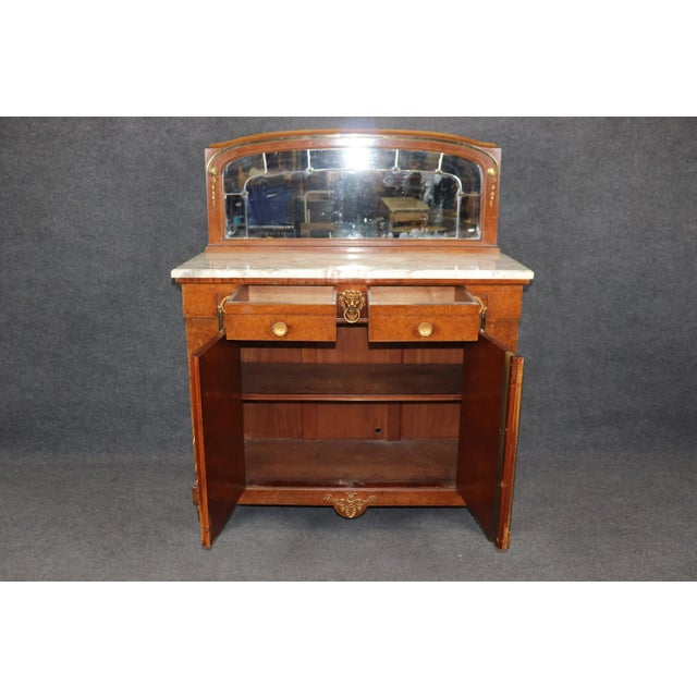 This signed Maison Krieger of Paris burled walnut buffet is a superb example of fine 19th-century French craftsmanship and...