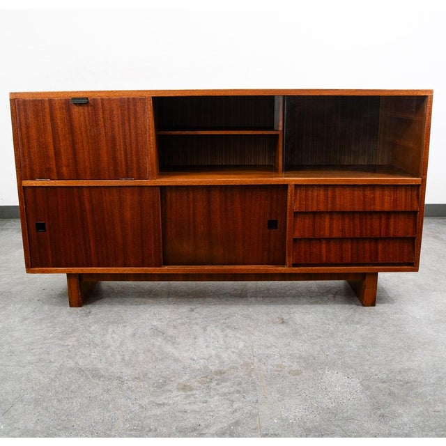 Teak and glass credenza / sideboard. Fully refinished throughout and ready for another 30 years. Unsigned example.