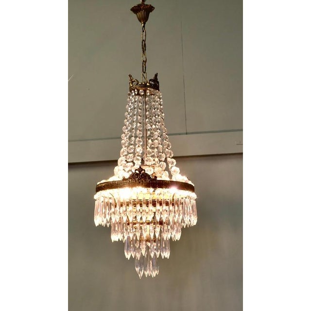 Large French Empire Style Crystal Waterfall Chandelier This is a large and Stunning piece, it has a gilt brass frame with...