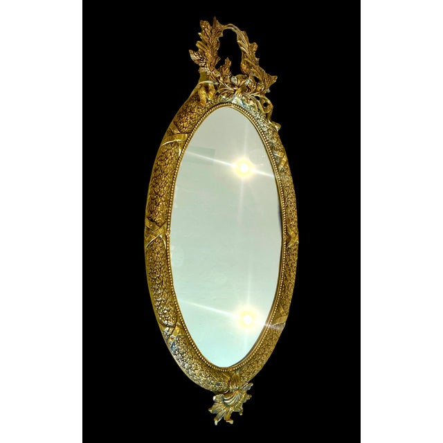 Beautiful vintage high end oval wall mirror made of solid brass with antique finish. The casting is excellent, very...