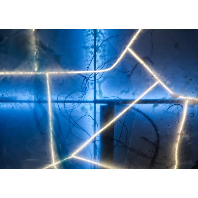 Split Ground Moon Wall Light by Joachim Ramin for Early Light, in New conditions. Designed from 2000 Signed by Maker,...