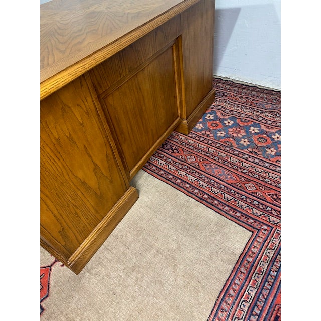 Solidly built and classic in design, this high-quality oak flat-top desk offers both durability and timeless style....