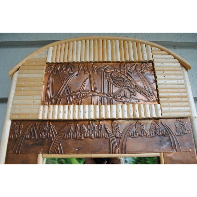 This unique mirror is a combination of natural bent bamboo and embossed copper. It has a continuous design of cat tails...