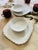Lovely collection of four pieces, two small berry bowls, and two salad plates, made in England, presented in all white...