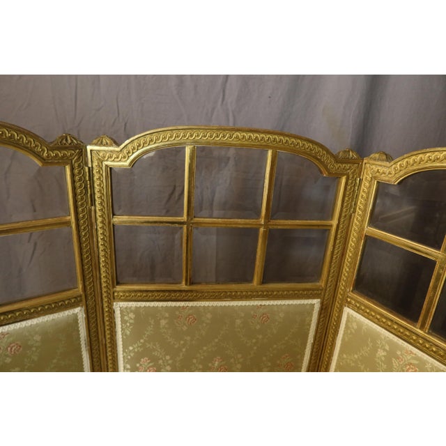 A three-panel giltwood screen in the louis xvi style, dating from the napoleon iii period. This screen is in perfect...