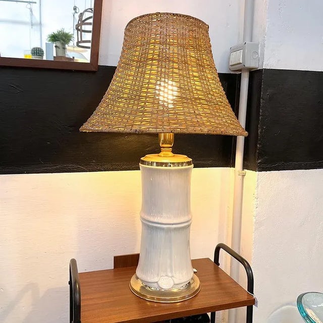 Singular vintage ceramic lamp with the bamboo cane -shaped base with a very valuable processing. The lampshade is in...