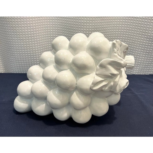 Sure, let me describe this decorative Vintage Newly Painted Gloss White Monumental Cluster of Grapes to you. This art...