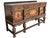 Impressive early 20th-century Jacobean Revival buffet or sideboard crafted in richly grained oak and extensively decorated...