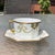 2 B&H (Blakeman and Henderson) circa 1890 Limoges Teacups that have a Lily of the Valley design outlined in gold with...