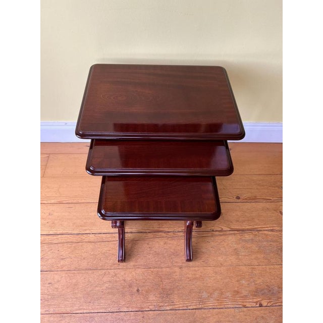 Set of 3 mahogany cross branded nest of tables
