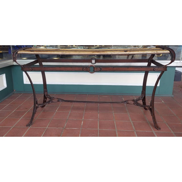 Vintage Adnet Hermes american western them faux leather iron, wood and glass long table that has a great design that looks...