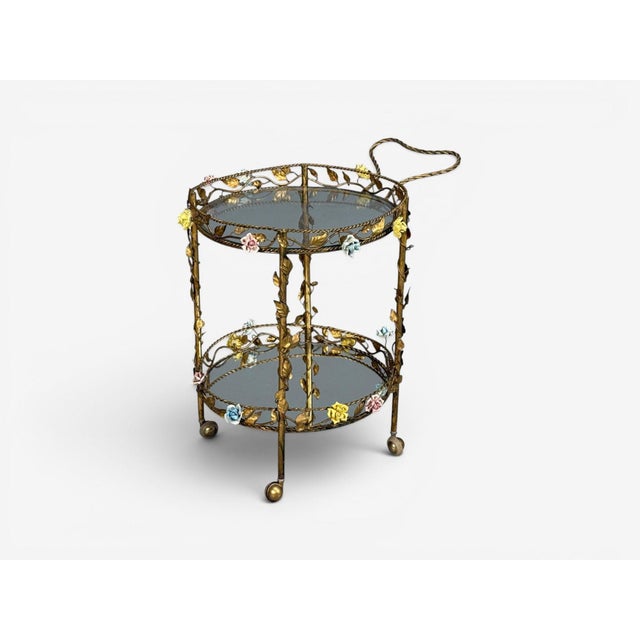 Hollywood Regency, Bar Car, Gilt Metal, Porcelain, USA, 20th c. A hollywood regency style bar cart or rolling trolley from...