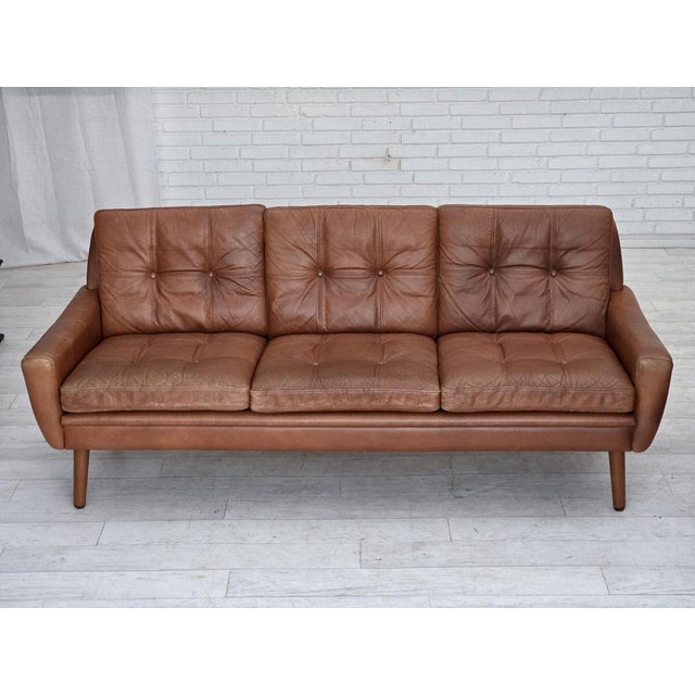 1970s, 3-seater Danish sofa. Original light brown furniture leather with patina. Beech wood legs. Original good condition:...