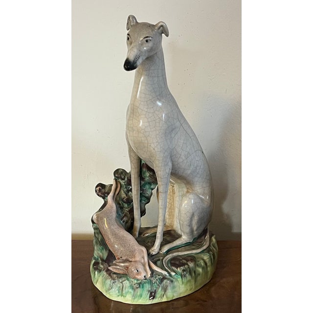 Very large antique 19th century English Staffordshire pottery figure of a Greyhound and hare measuring 12 3/8" tall. The...