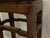A pair of 19th century tall, square Chinese elm wood side tables or pedestal stands with exposed tenon joints, humpback...