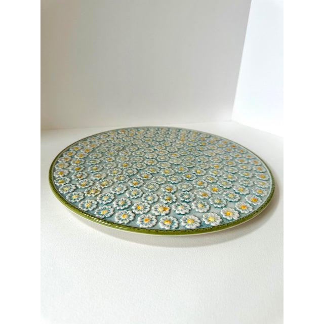 A charming vintage Italian majolica platter featuring an allover raised daisy motif in soft white and butter yellow...