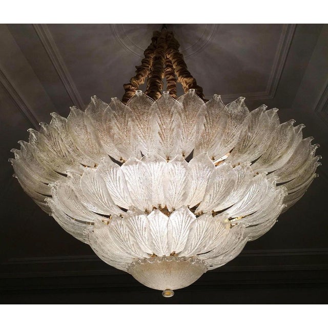 Realized in pure Murano glass consist of an incredible number of leaves. The structure is plated with gold 18 lights...