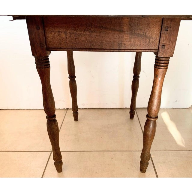 Charming small master's table in natural wood two drop leaves and four turned legs good condition dimensions when closed:...