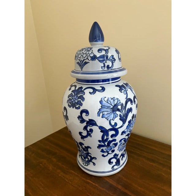 A classic blue and white ginger jar, decorated throughout with delicate Chinese floral motifs. The pattern is dense yet...