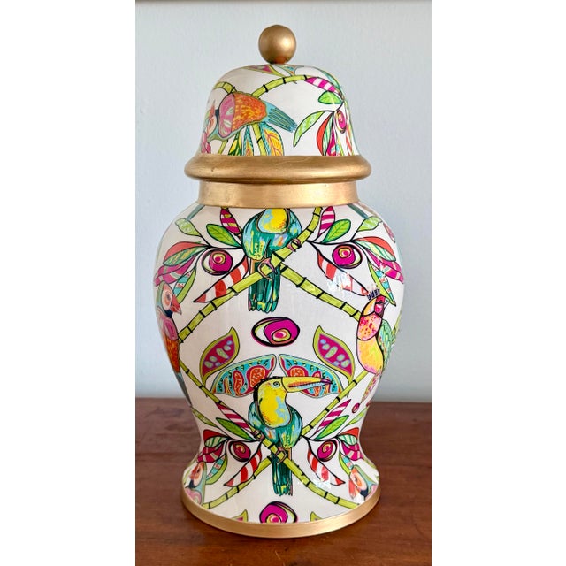 Hot pink and green decorated ceramic ginger jar with parrots on perched on bamboo branches. Wonderful tropical theme....