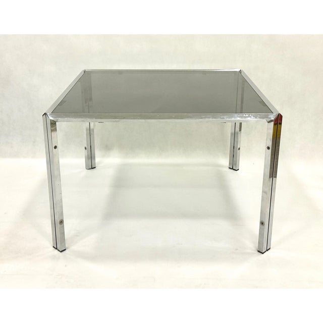 Mid-Century Chrome and Smoked Glass Coffee Table, 1980s, in Very Good conditions. Designed 1980 to 1989