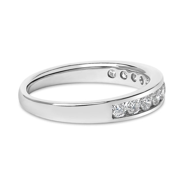 Embrace timeless elegance with this meticulously crafted 14k white gold wedding band, adorned with a row of 11 natural,...