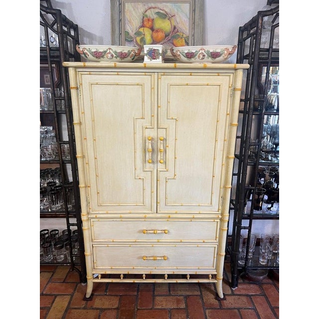 1970's Faux Bamboo Yellow Armoire by Century Furniture . Soft yellow with bright yellow accents this beauty will light up...