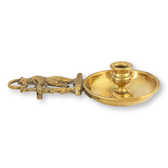 Late 19th century English brass chamberstick candleholder featuring an unusual figural bear serving as the upright handle....
