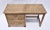 Pencil reed rattan writing desk of solid wood construction in a geometric Chevron pattern with original brass hardware,...