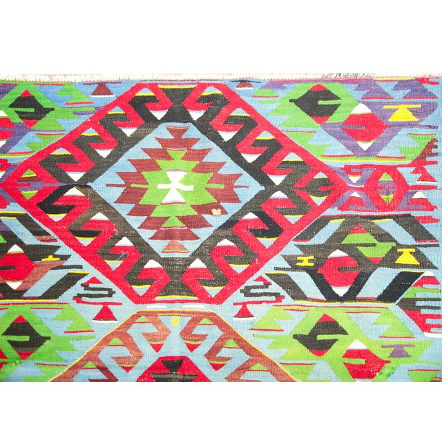 An irresistible mid-20th century Turkish Kilim rug with the most wonderful tribal pattern with several medallion with...