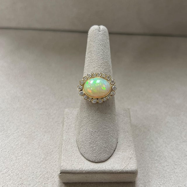 Created in 18 karat yellow gold Ethiopian Opal 3.70 carats approx. Diamonds 0.60 carat approx. Ring size US 6.5, can be...