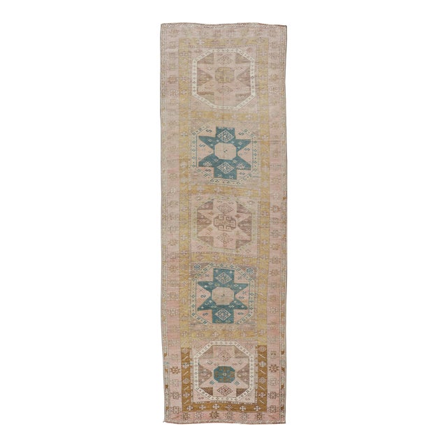 Antique Turkish Oushak Runner With Star Medallion Design in Pastel Tones For Sale