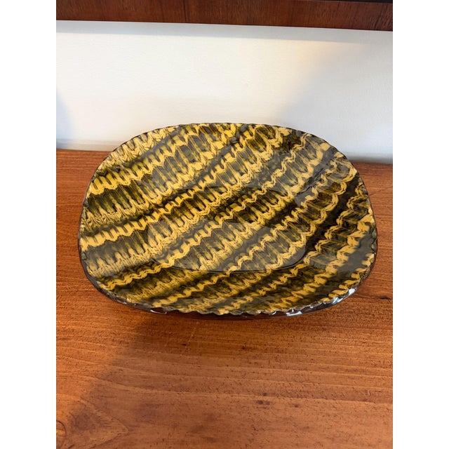 A stunning French Slipware Earthenware Dish from La Tuile a Loup in Paris from my personal collection. La Tuile a Loup is...