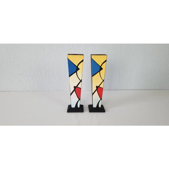 For your consideration we are presenting for sale is a stunning pair of vintage / postmodern hand painted wood decorative...