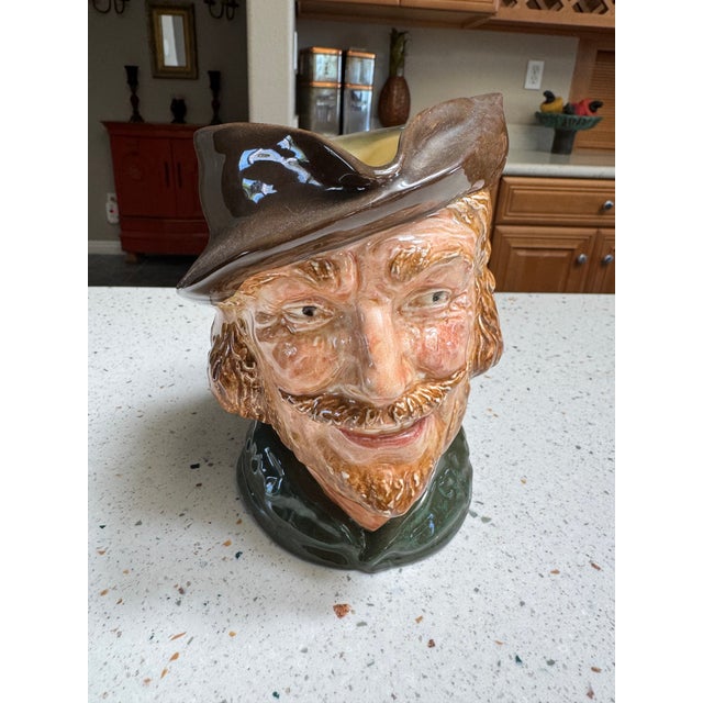 Bring a touch of English folklore into your home with this striking Royal Doulton character jug, featuring the legendary...
