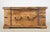 Reclaimed square trunk made of distressed wood with steel banding and hardware. It features a large interior with two lids...