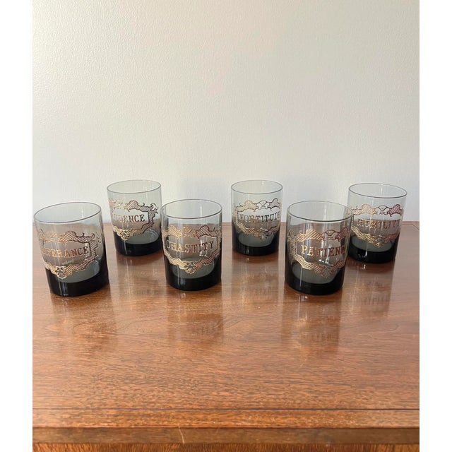 Six rocks glasses by Neiman Marcus each diplaying one of the classical virtues - Prudence, Humilty, Patience, Chastity,...