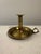 Antique brass chamberstick candle holder featuring a traditional push-up mechanism, circular drop pan and finger-loop...