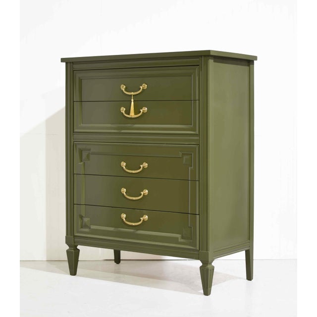 Freshly updated with a newly painted finish, this Thomasville five-drawer highboy chest in green blends clean mid century...