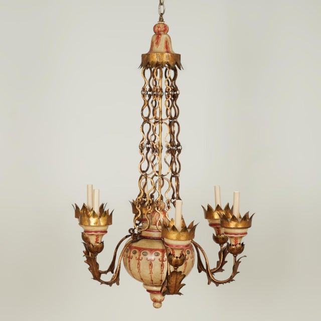 Stately antique Italian six light chandelier crafted with gilt metal chains, crown candle cups and acanthus leaves with...