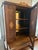 Beautiful antique Colonial Revival display cabinet dating to the early 20th century. This elegant piece features a...