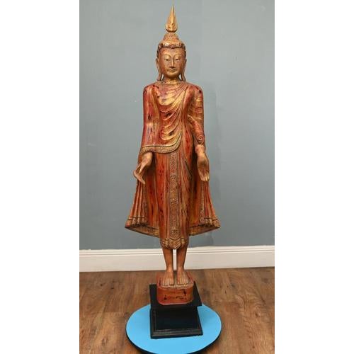 Elegant hand-carved wooden figure of a standing Buddha Burma (Myanmar) – Mandalay period or in that tradition. Depicted in...