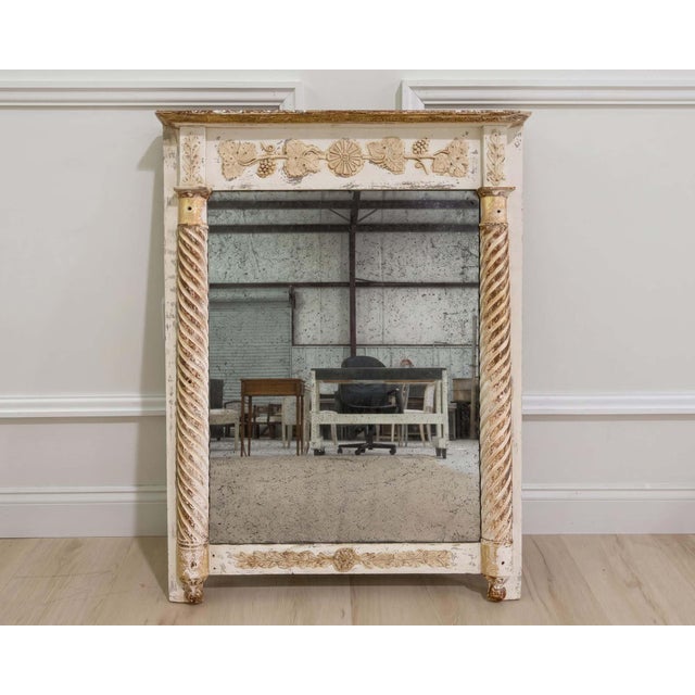 A charming 19th century French mirror featuring its original mirror plate, original back, and beautifully preserved...