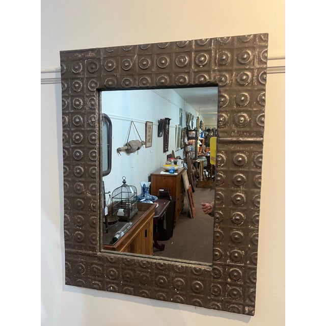 Beautiful handcrafted one of a kind antique ceiling tin mirror.