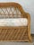 This vintage three-seat sofa captures the essence of coastal elegance through its masterful use of natural rattan and...