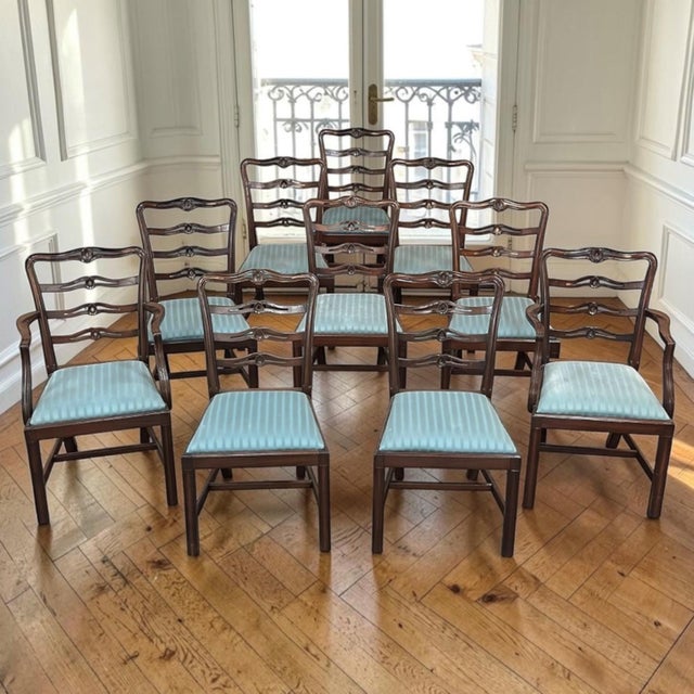 A beautifully crafted set of ten solid mahogany Edwardian dining chairs, including two matching armchairs, offering the...