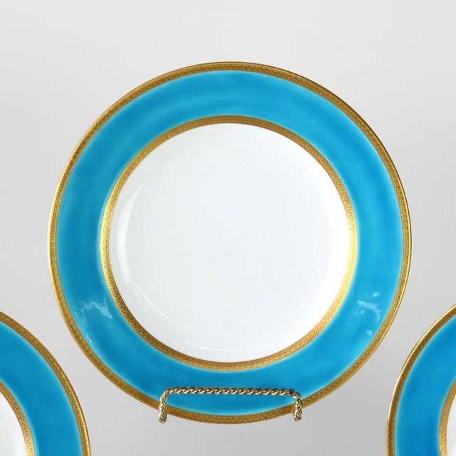 This set of twelve antique English luncheon plates by Spode Copeland, crafted from fine porcelain around 1900, features a...